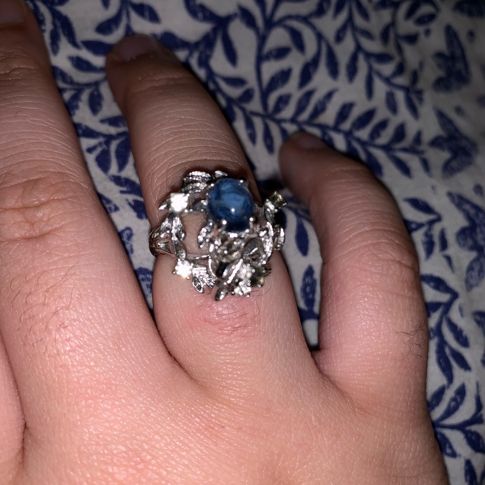 Floral silver ring with light blue gem stone